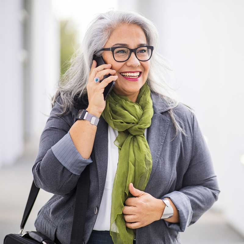 Woman talking on her hearing aid compatible cell phone